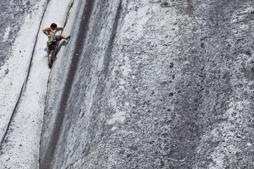 A strong male climber climbing Crescent Crack 10d, Squamish, BC