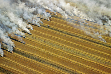 Aerial of residual crop burning in Manitoba, Canada.