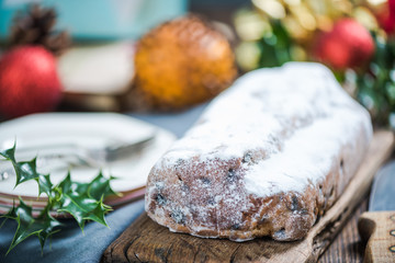 Christmas stollen cake on festive decorated table