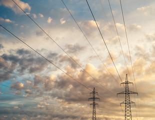 High voltage line against scenic cloudscape