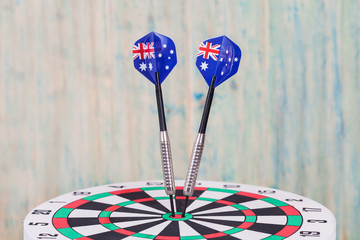 Darts arrow with Australia flags on red dart board