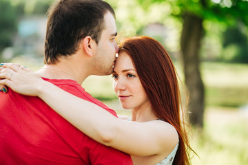 Young couple in love outdoor.Stunning sensual outdoor portrait of young stylish  couple posing in summer i, nature background