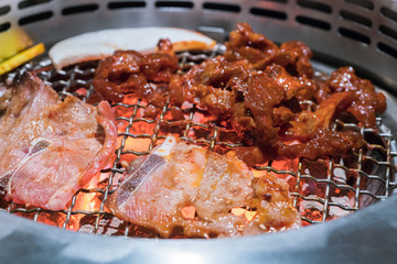 Beef and Pork grill on hot coals. This kind of food is a Korean BBQ style.
