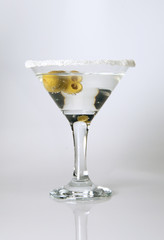 Martini glass close-up, decoration on the edge of a white crumb