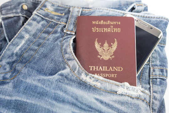The old jeans with passport and mobile phone.