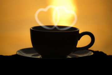 Silhouettes of morning coffee on the lake.