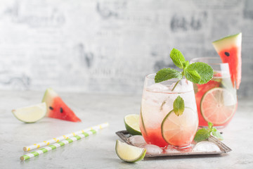 Fresh watermelon lemonade with lime, ice and mint for the summer party on the metal tray - obrazy, fototapety, plakaty