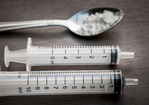Drug syringe and cooked