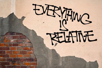 Everything Is Relative - Handwritten graffiti sprayed on the wall, anarchist aesthetics. Postmodern relativization of morality, ethics, values. Everything is personal arbitrary opinion