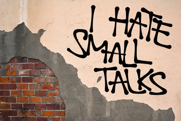 I Hate Small Talks - Handwritten graffiti sprayed on the wall, anarchist aesthetics. Aversion...