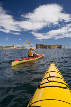 Sea-kayaking near Perce Rock, Gaspe, Quebec, Canada.