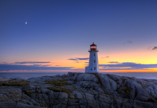 Sunset over lighthouse, Peggy's Cove, Nova Scotia, Canada