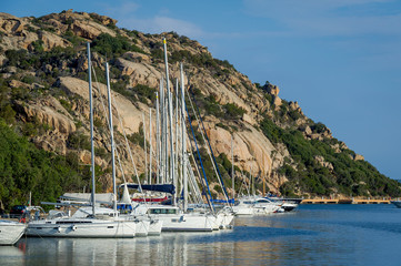 Fototapeta na wymiar Sailing boats at Poltu Quatu resort marina, Sardinia