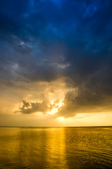 Beams of the sunset over the lake