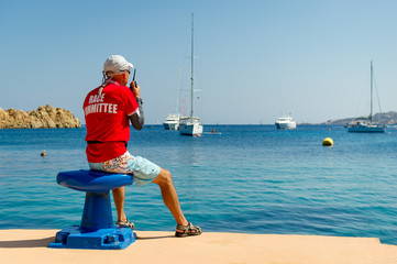 Sailing race referee watching at the yachts in beautiful bay