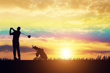 silhouette Man playing golf on a golf course in the sun