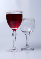 Wine glass close-up, decoration on the edge of a white crumb