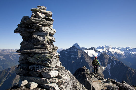 A young man alpine climbing the west ridge of Mt Tupper, Roger's Pass, Glacier National Park, BC