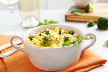 Delicious pasta Al Forno in ceramic bowl on orange napkin, closeup