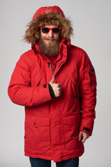 Smiling bearded man showing thumb up