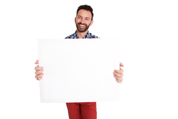 Happy mature guy showing blank poster sign