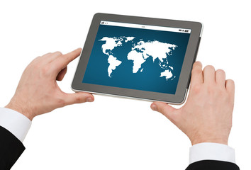 close up of hands holding tablet pc with world map