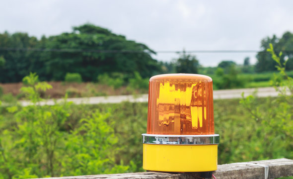 Yellow Siren Light On Wood