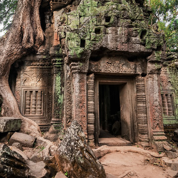 Ancient Khmer architecture. Ta Prohm temple with giant banyan tree at Angkor Wat complex, Siem Reap, Cambodia. Two images panorama