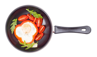 Egg in pepper on a frying pan