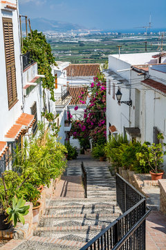 Beautiful narrow street in Salobrena (Salobreña) old town, leading the the castle, Spain