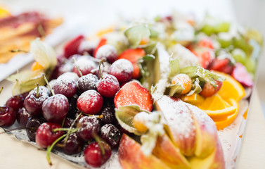 close up of dish with sugared fruit dessert