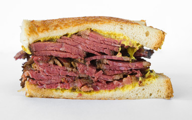 Smoked meat beef sandwich with mustard and black pepper corns, isolated on white