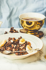 Homemade сhocolate granola with banana and peanut butter,tintin