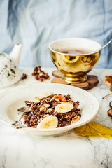 Homemade сhocolate granola with banana and peanut butter