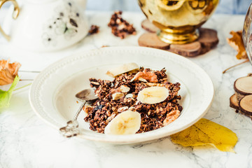 Homemade сhocolate granola with banana and peanut butter