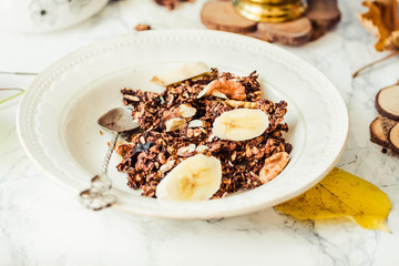 Fototapeta na wymiar Homemade сhocolate granola with banana and peanut butter
