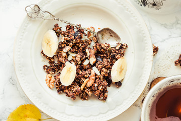 Homemade сhocolate granola with banana and peanut butter,autumn