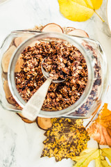 Homemade сhocolate granola with banana and peanut butter,autumn