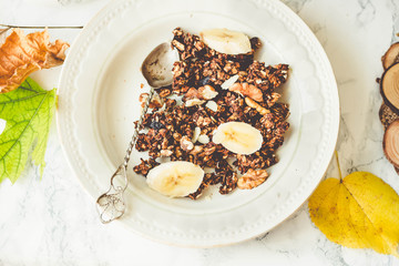 Homemade сhocolate granola with banana and peanut butter,tintin