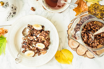 Homemade сhocolate granola with banana and peanut butter,autumn
