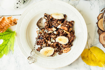 Homemade сhocolate granola with banana and peanut butter