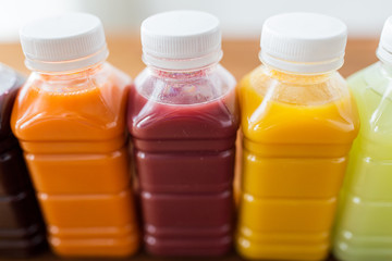 bottles with different fruit or vegetable juices