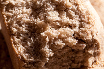 Organic home made bread with flax seeds and rural background