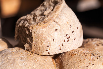 Organic home made bread with flax seeds and rural background