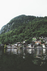 Houses on mountain close to the lake