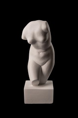 Gypsum statue of Venus on a black background