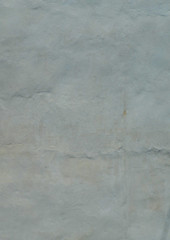 Background texture of a shabby, whitewashed, concrete wall.