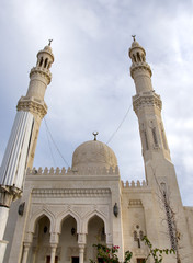 Tower minaret against a bright blue sky, Hurghada, Egypt