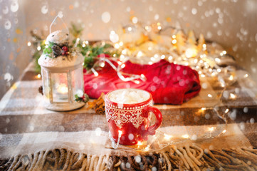 Fototapeta na wymiar cup of hot cocoa with marshmallow with Christmas decorations at home, Christmas tree on background, cozy mood