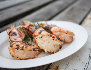 grilled tiger prown on wood pallet